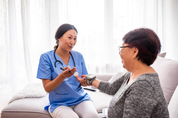 Nurse checking patient's blood pressure
